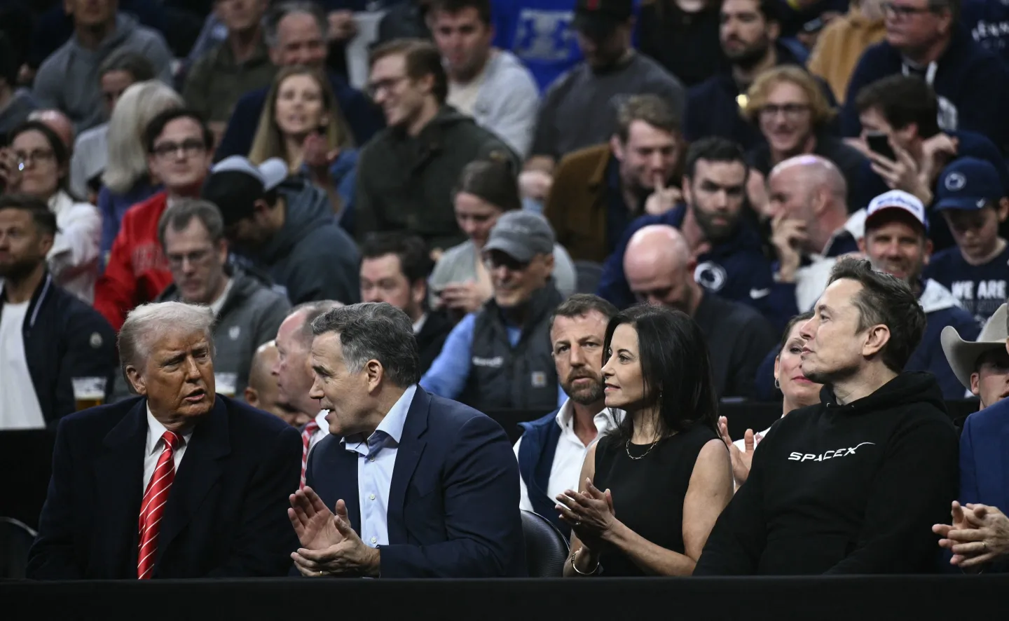 US President Donald Trump, Senator Dave McCormick, his wife Dina Powell McCormick and Elon Musk watch the men's NCAA wrestling competition at the Wells Fargo Center in Philadelphia, Pennsylvania, on March 22, 2025.