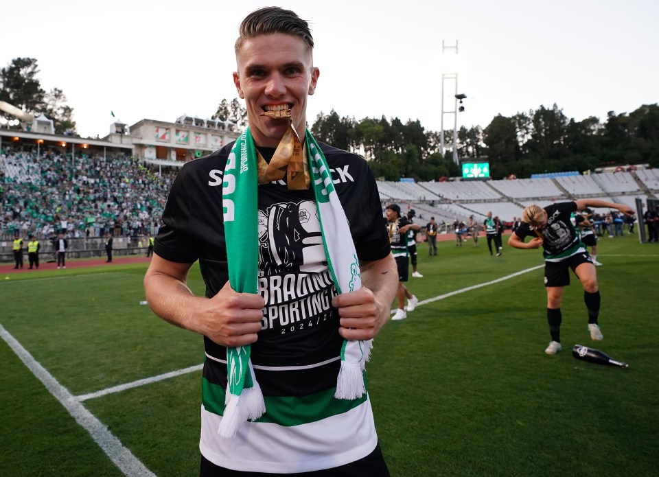 Viktor Gyokeres of Sporting CP celebrates winning the Portuguese Cup, holding a gold medal.