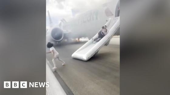 Passengers use emergency slides to flee plane fire at Denver airport