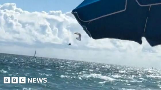 Paraglider survives 500ft drop into ocean