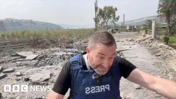 Missile lands next to presenter during live report