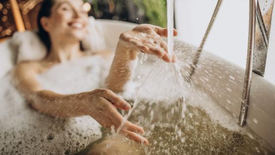 This is why you should be taking more baths this time of year, according to a doctor