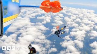 Moment skydiver’s parachute wraps around plane