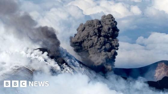 Snow-capped Mount Etna erupts as skiers glide down slopes