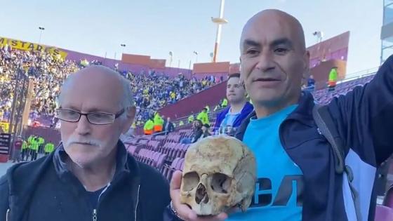 Bizarre moment football fans turn up to cup final with HUMAN SKULL of grandfather and say ‘we take him everywhere’
