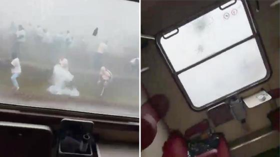 Terrifying moment football thugs launch firecrackers and stones at train filled with rival supporters