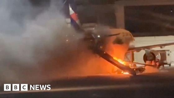 Flames and thick smoke engulf plane in Brazil after fire breaks out