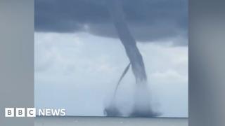 Twin waterspouts merge near Italian coastline