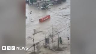 Shipping containers swept away in deadly Philippines floods
