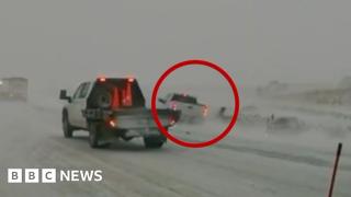 Car nearly hits first responders in Midwest blizzard conditions