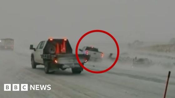 Car nearly hits first responders in Midwest blizzard conditions